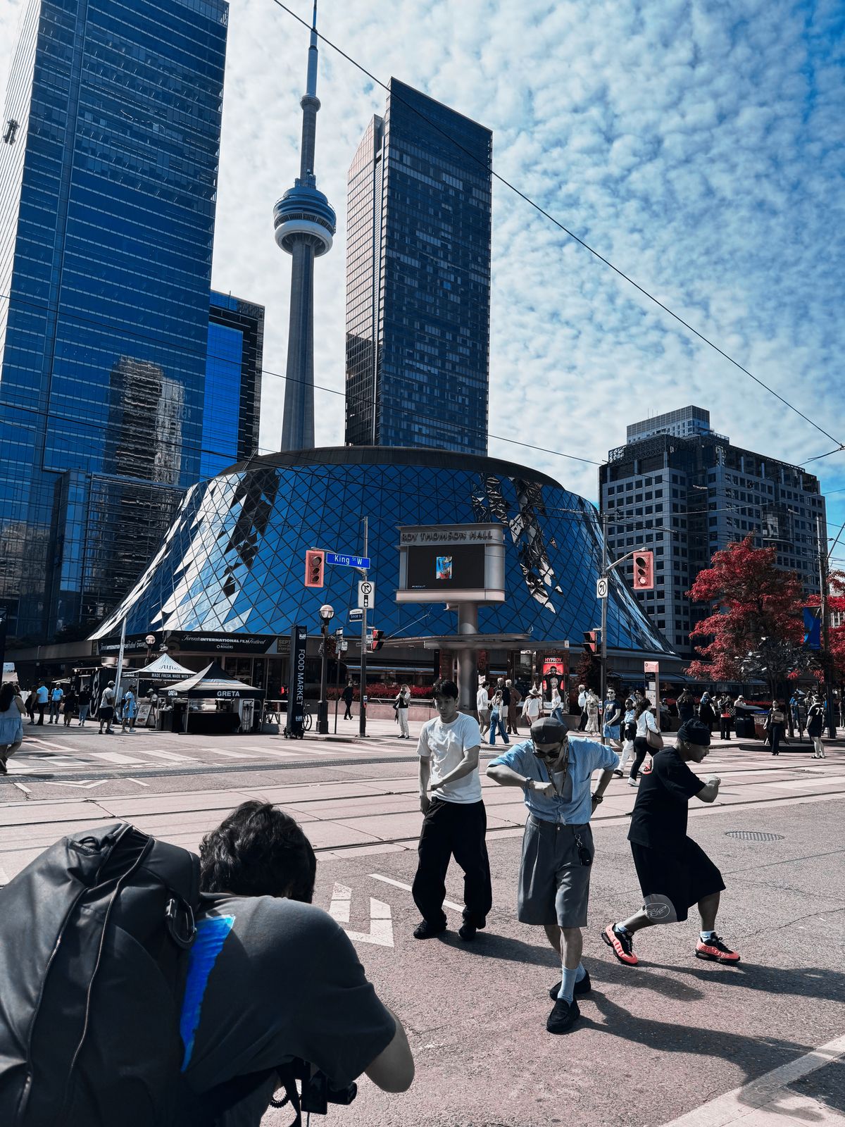 The team dancing in front of the CN Tower